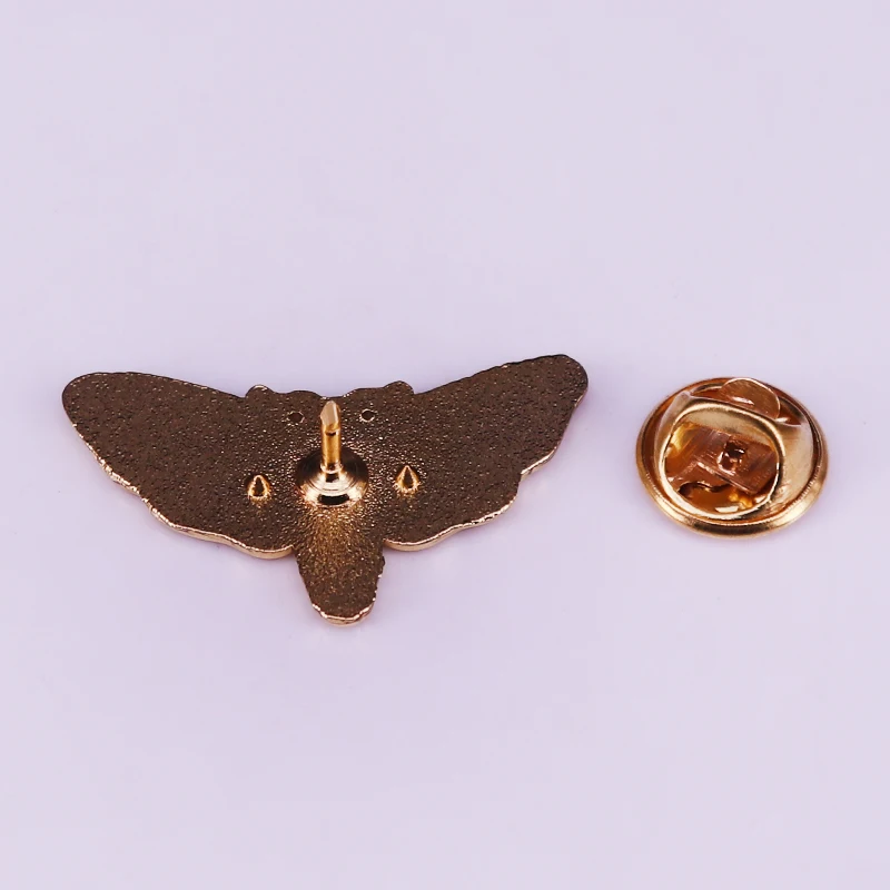 The iconic death head moth enamel pin that Buffalo Bill coveted so much in Silence of the Lambs.