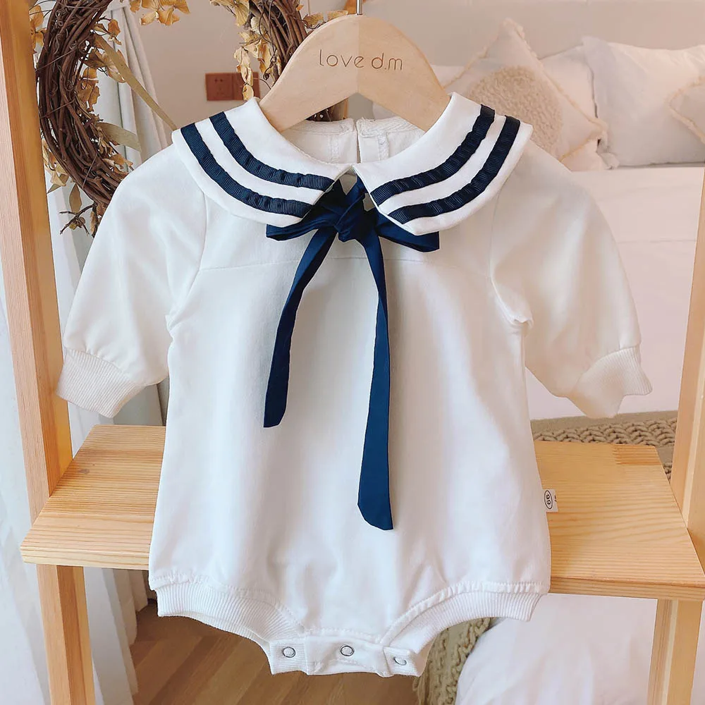 beige long sleeve baby onesie