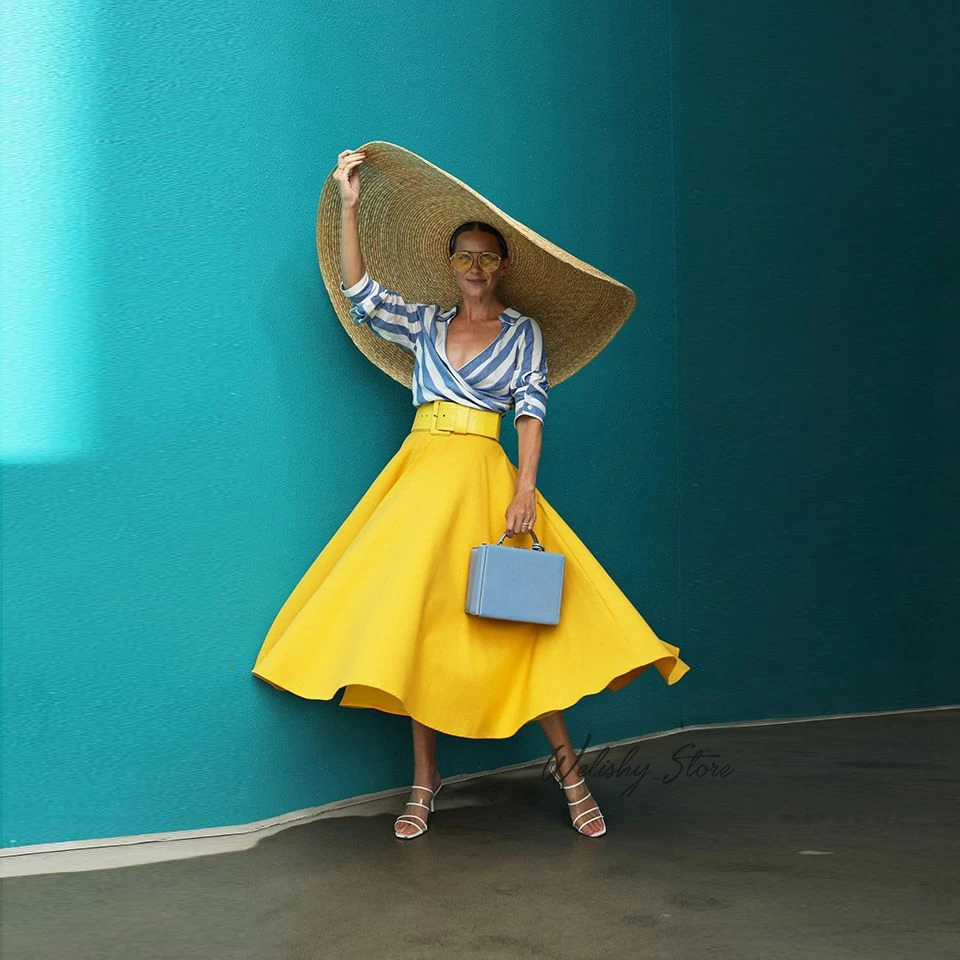 blue top and yellow skirt