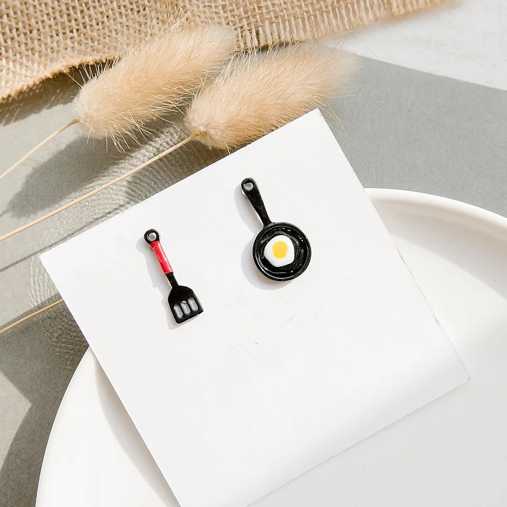 

Korean style fashion personalized small pot shovel fried eggs interesting earrings simple ins Net Red student female earrings