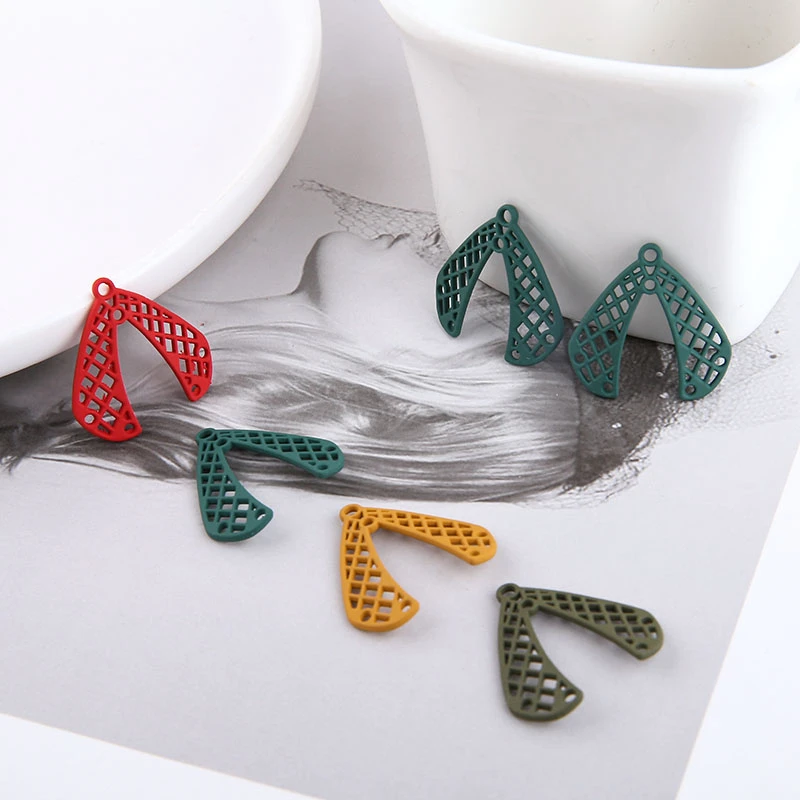 

8 Pcs New Creative Charms personalized alloy frosted spray wings alien porous pendant earrings for girls DIY jewelry accessories