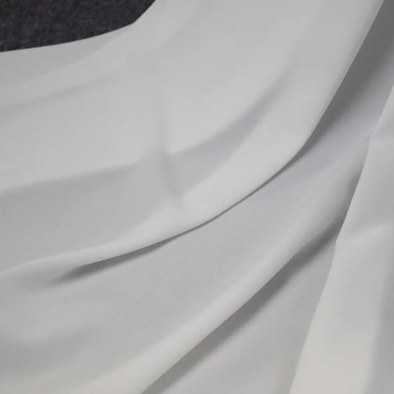 https://ae01.alicdn.com/kf/H9d9a4a4bd74447c3a9997f75707fc259f/Half-Meter-High-Quality-Solid-Color-White-Or-Black-Elastic-Chiffon-Fabric-For-Garment-Lining-Shirt.jpg