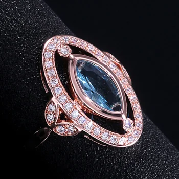 

Huitan Charns Mysterious Women Party Rings With Clear Sky Blue Stone Oval Rose Gold Color Micro Paved Cocktail Party Ring