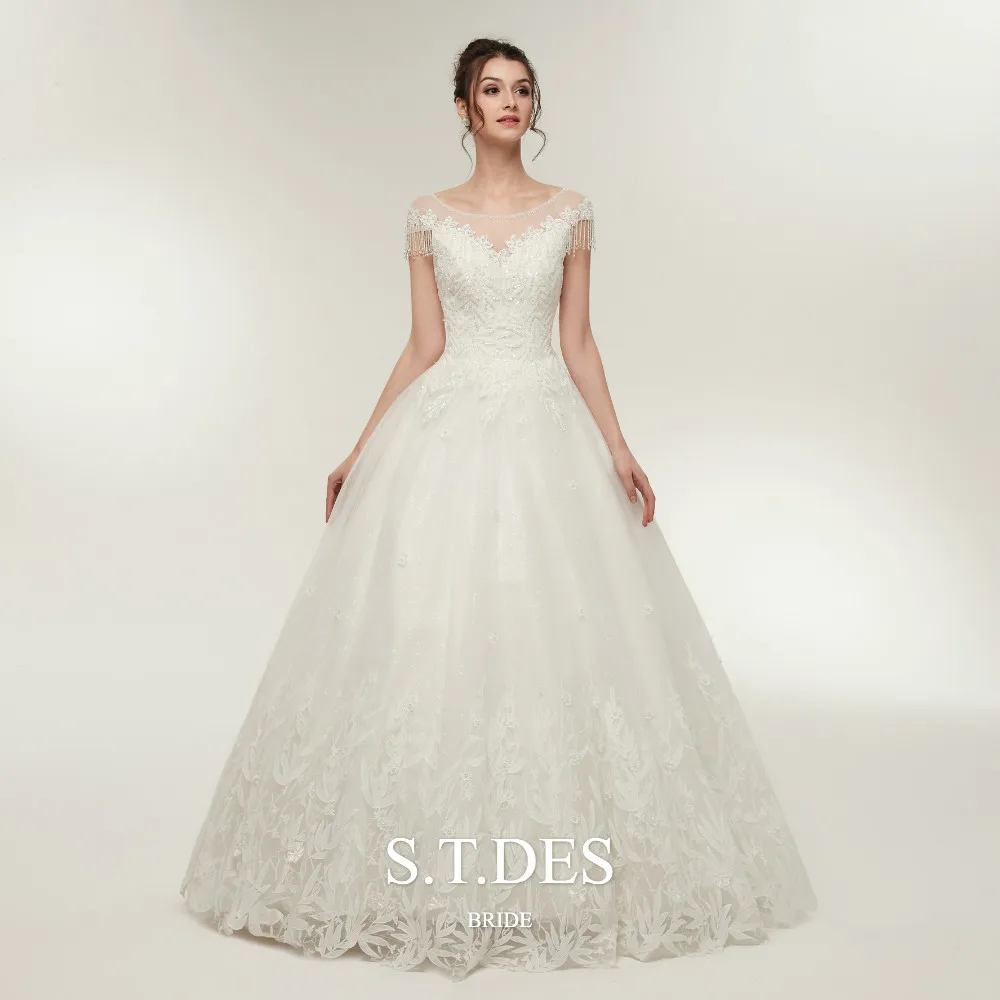 

2020 S.T.DES Elegant Sheer Neck Crystal beading Tassel Cap Sleeves Ball Gown Sequins Applique Lace Floor-Length Wedding Dress