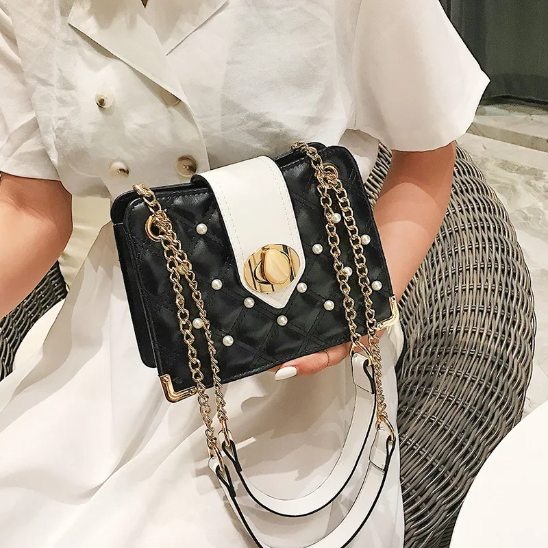 

New type of stereoscopic lady bag with pearl pebble lock iron angle single shoulder and inclined shoulder