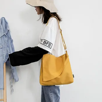 

2020 new Korean version of ins simple girl messenger canvas bag small fresh student shoulder bag female