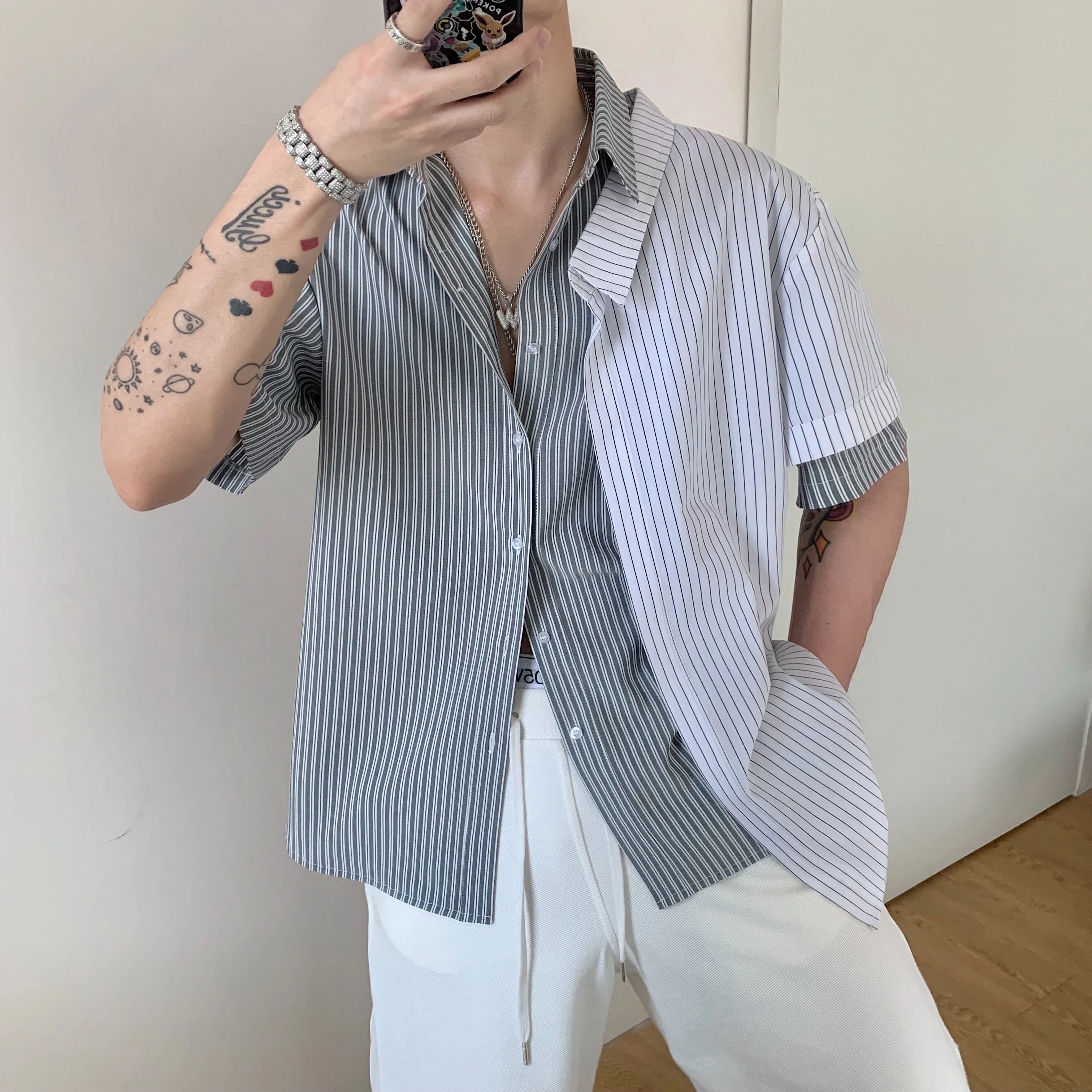 

New fashion layered patchwork striped contrast color comfortable wrinkle resistant neutral loose shirt with short sleeves.