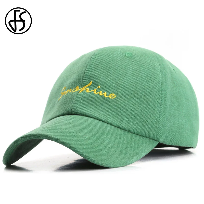 red and green baseball caps