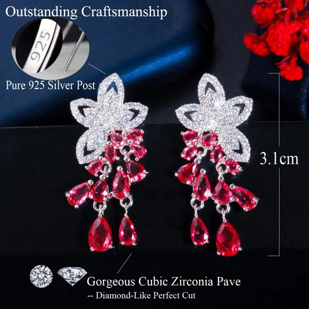 Platinum plated fancy cut cz earrings with purple stone drops -