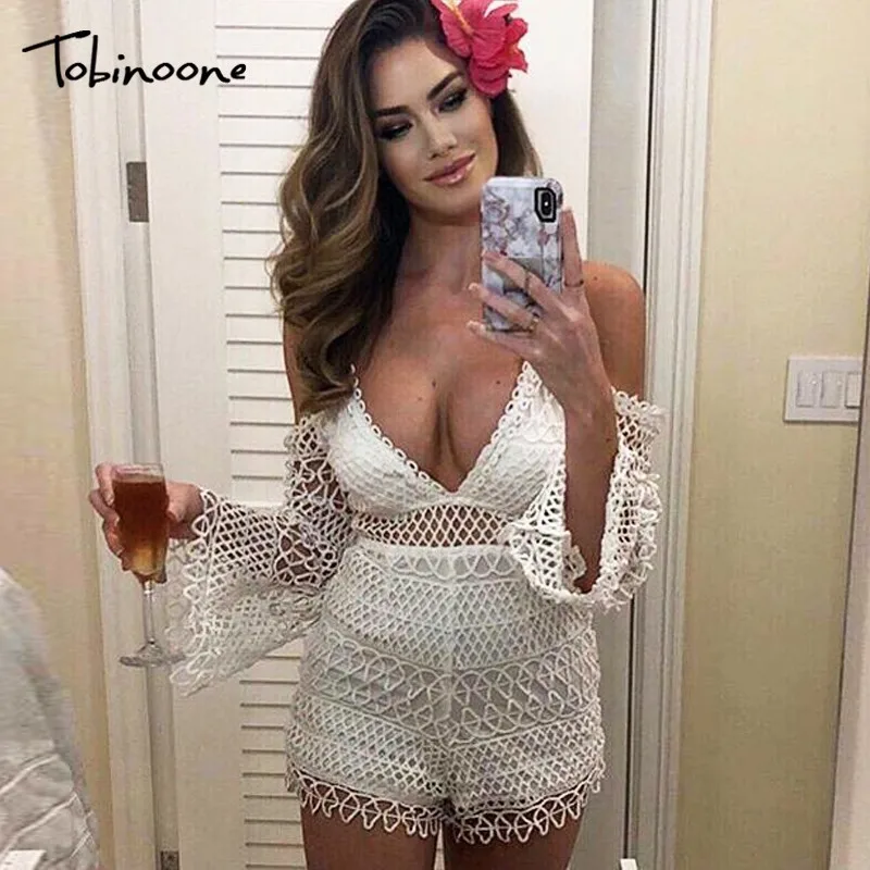 

Tobinoone Sexy lace jumpsuit romper Women deep v neck hollow out overalls Summer 2019 long flare sleeve white playsuit clubwear