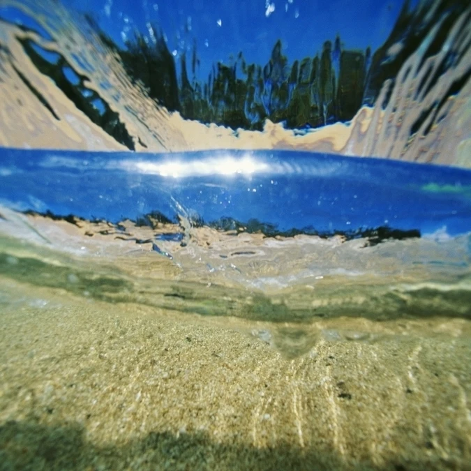 Hawaii Underwater Breaking Wave Sand Sky And Trees Visible Through Clear Water Poster Print (19 x 12) | Дом и сад