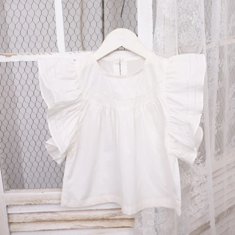 girls white frilly blouse