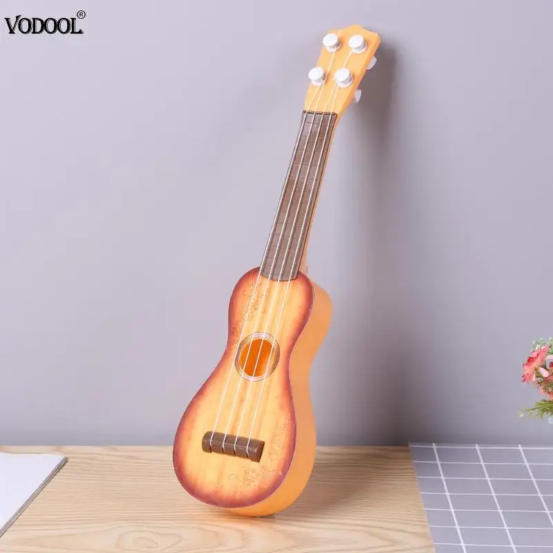 

Mini Simulated Ukulele Guitar Musical Instrument Kids Education Toys Gift