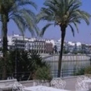 Sidewalk cafe at the riverside Guadalquivir River Seville Spain Poster Print (18 x 6) | Дом и сад