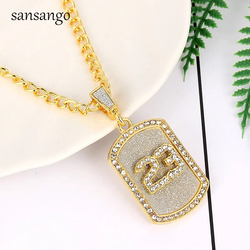 number 23 gold pendant