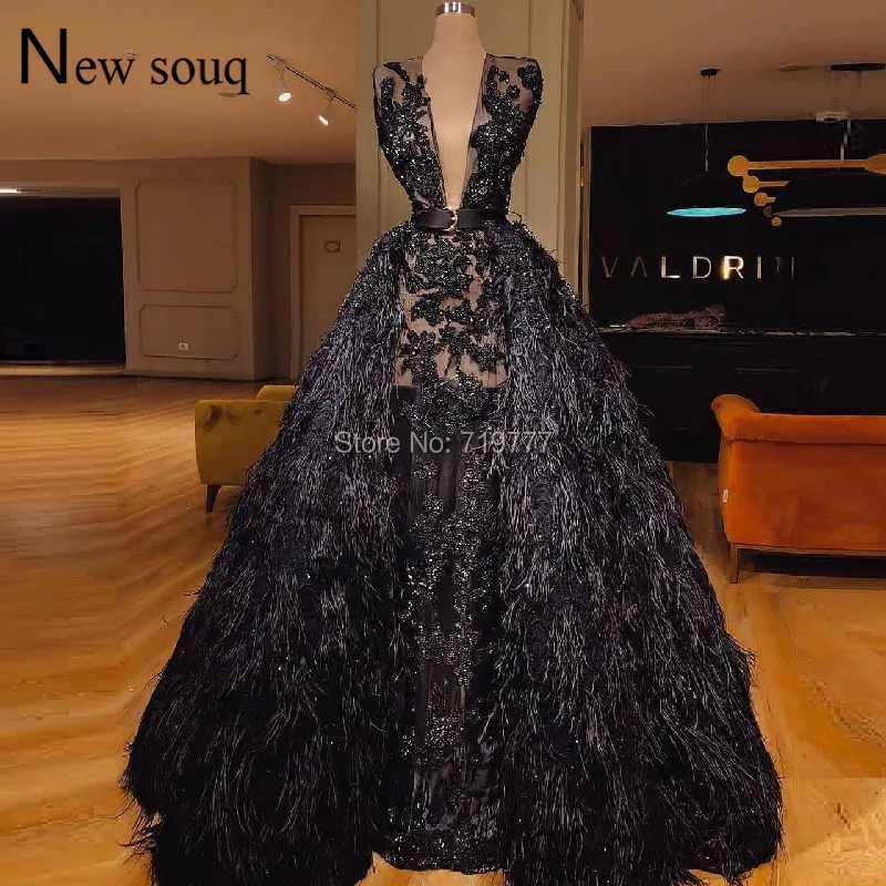 black dress with feathers on top