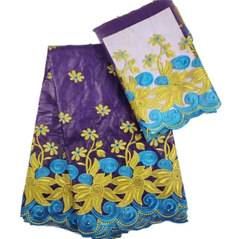 

Yellow flowers and blue waves pattern with Beads 5 yards Bazin Riche and 2 yards net lace TW35 purple color Nigeria WAX Fabric