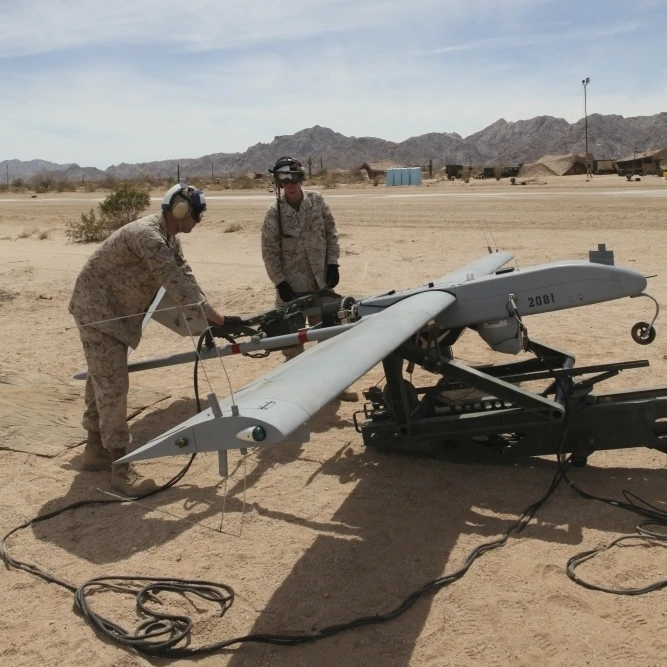 U.S. Marines prepare to start the engine of an RQ-7 Shadow Poster Print (22 x 34) | Дом и сад