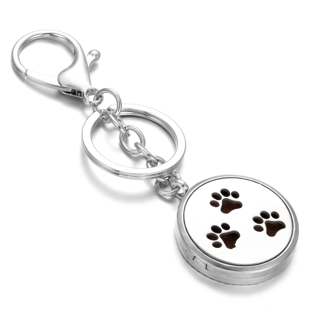 

2019 New Dog Footprints Aromatherapy Key Chain Hollow Out Open Perfume Oil Essential Locket Diffuser Key Chains with Pad