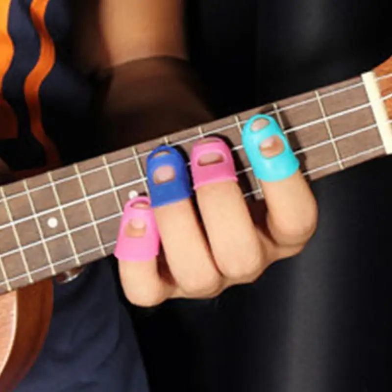 

4Pcs Fingertip Protector Fingerstall Silicone Guitar String Finger Guard Against the Press Finger Ballad Guitar Accessories ~