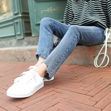 wholesale price women jeans wrinkle wash irregular cut hem flare denim pants