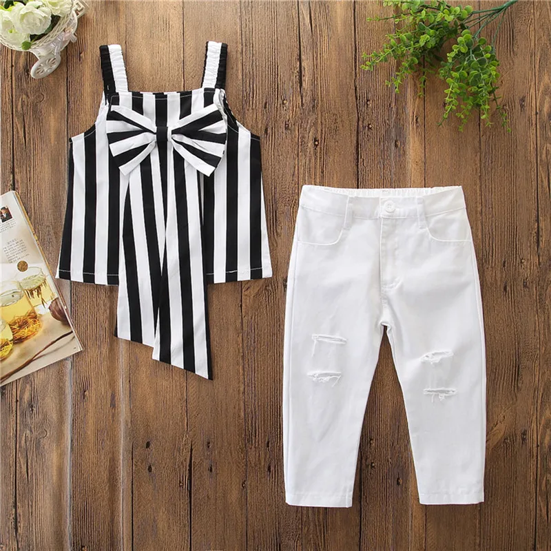 

1-5Y Fashion Kids Baby Girl Summer 2Pcs Outfits Striped Big Bow Strap Vest Tops White Holes Long Pants Kids Girl Clothing Sets