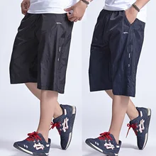 Мужские летние свободные повседневные шорты больших размеров 6XL, спортивная одежда, большие брюки однотонные дышащие мужские шорты с эластичной резинкой на талии