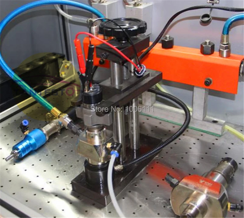 

diesel common rail injector clamp frame installed in the common rail test bench, with diesel oil collector