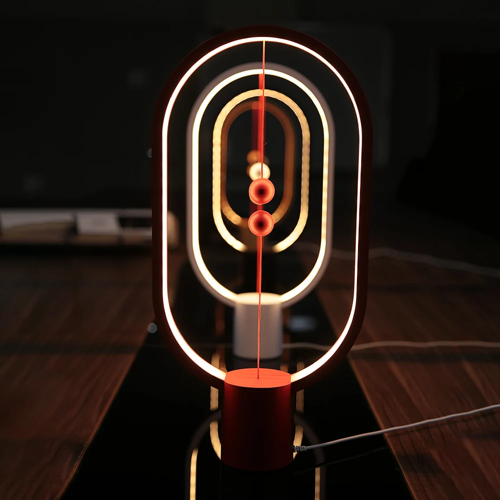 

Creative Smart Magnetic Switch LED Table Lamp USB Warm Night Light Ellipse Magnetic Mid-Air Switch Heng Balance Decorative Light