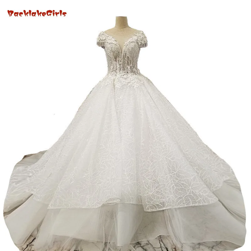 

2018 New Arrival Ivory Champagne Lace Wedding Dresses Sleeveless Deep V-neck Cathedral Train Lace Up Ball Gown Wedding Gowns