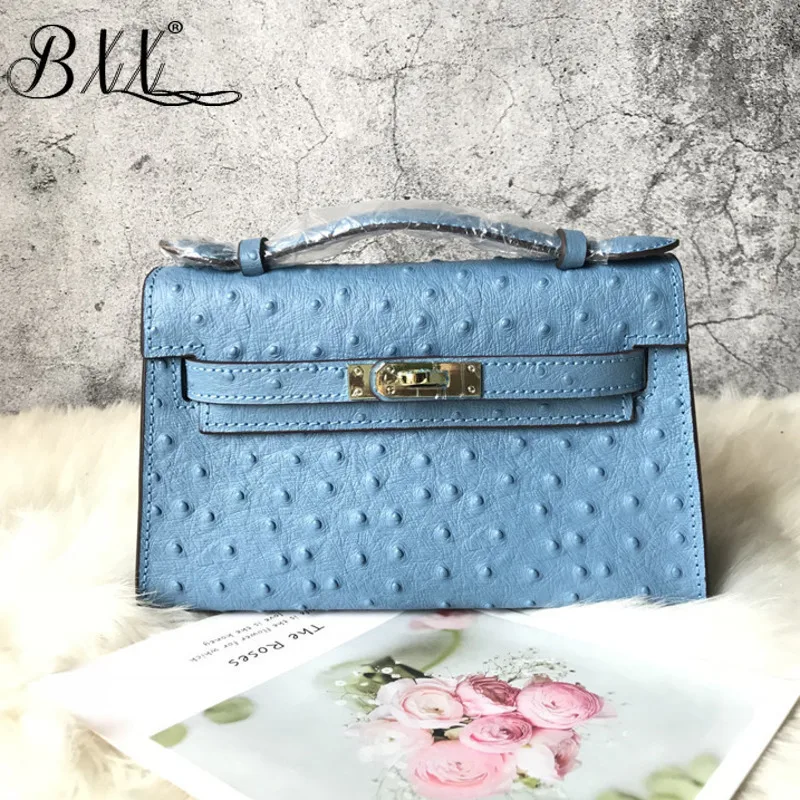 

BXX bag / 2019 New Spring And Summer Leather Dots Metal Covered Hand Package Small Business Bags WE97211 Purple Color