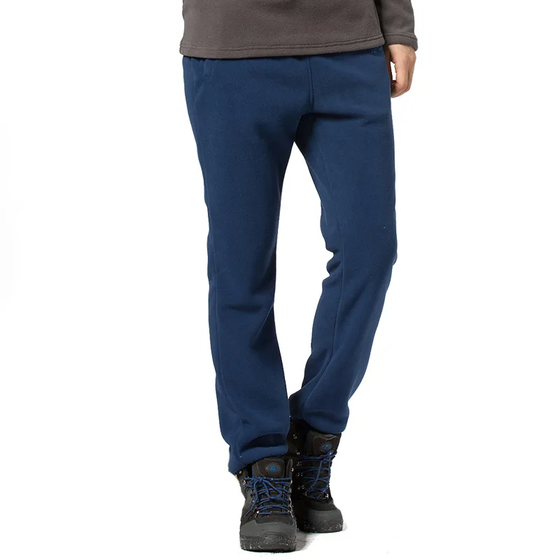 Plus tamaño de otoño de los hombres de invierno al aire libre de las mujeres al aire libre Camping senderismo pantalones gruesos de lana deportes Polar tela Polar a prueba de viento pantalones térmicos