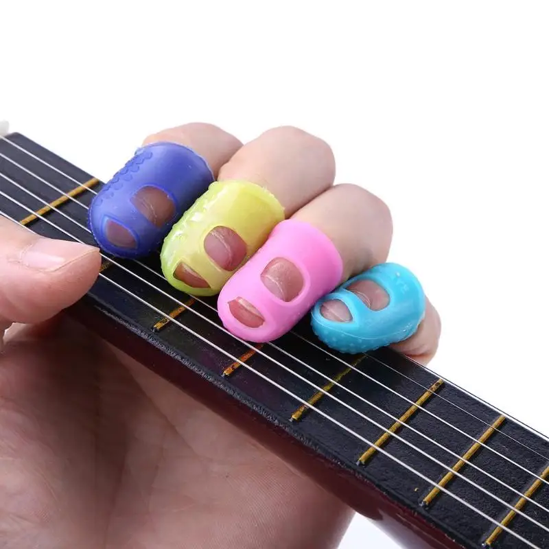 

4pcs Silicone Guitar Thumb Finger Picks Protector Fingertip Fingertip thimble Finger Guard safety protect caps Colors Selected