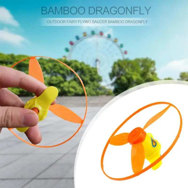 أطفال في الهواء الطلق اليعسوب قاذفة لعبة الأطفال تدور ضوء اليد تحلق الصحن رمي الصيد القرص اللعب مضحك الفتيان الفتيات تحلق لعبة