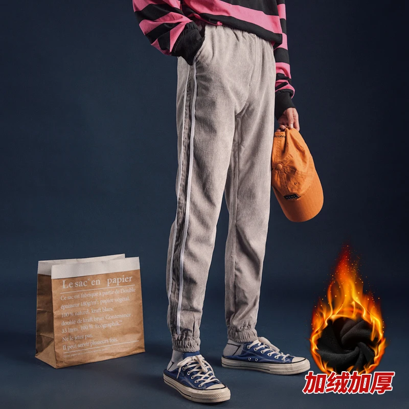 

2018 Autumn and winter Japanese Male Cashmere thickened movement casual pants students loose stripe printing Beam foot trousers