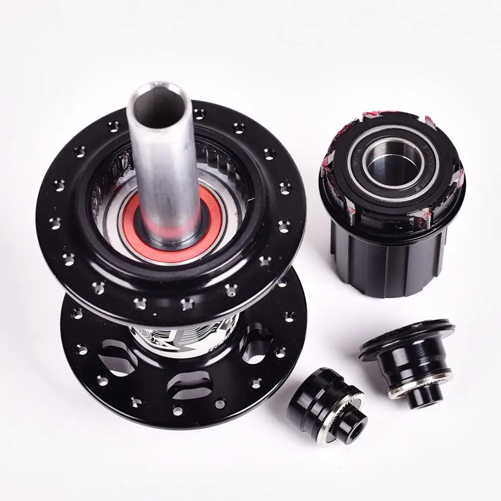 Baratos Nuevos bujes Koozer 4 rodamientos MTB Cubo de bicicleta de montaña trasero 10*135mm QR100 * 15 12*142mm a 28 32 36 agujeros buje de bicicleta de freno de disco XM490