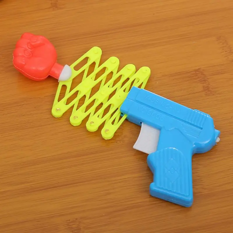 

2018 new hot sales Prank Elastic Spring Fist Magic Weapon Funny Children Toys
