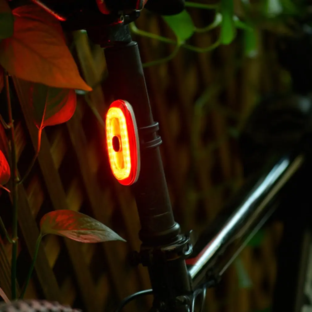 مكافحة سرقة إضاءة دراجة هوائية الذكية الضوء الخلفي لص إنذار USB قابلة للشحن ليلة السلامة فلاش الفرامل ضوء الدراجات المعدات مصباح