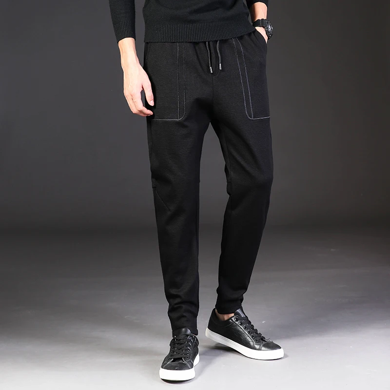 

The new casual pants male autumn popular logo young men's trousers are black embroidery harlan elastic waist pants feet pants