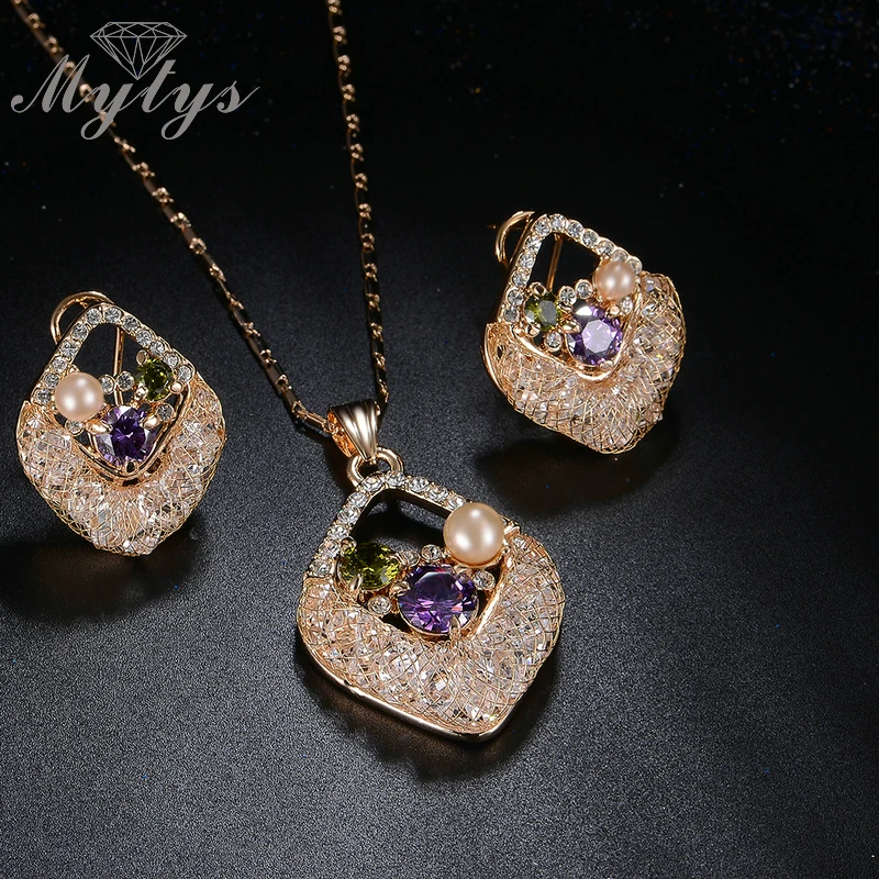 

Mytys Limited Sale Pearl Crystal Pendant Necklace and Earring Sets Wire Mesh Net Crystal Sets Jewelry for Women CN291