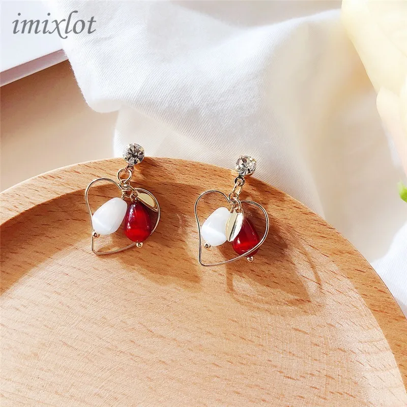 

Korean earrings female hit color cat's eye drop earrings hollow love earrings earrings