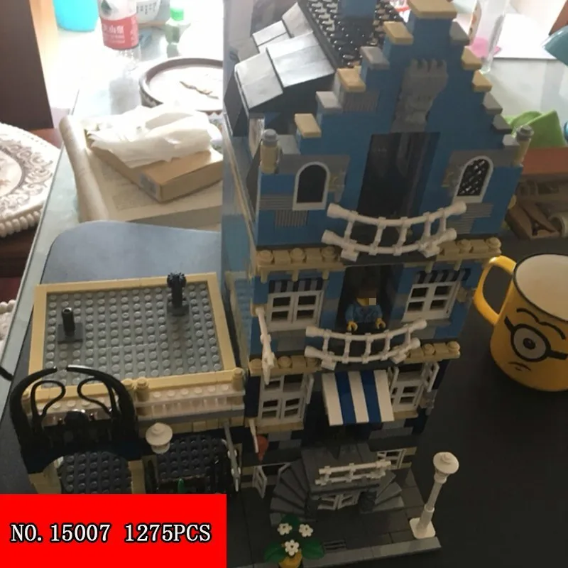 

15007 Series Out Of Print Europe Market Street Children Assembling Spelling Insert Alpinia Oxyphylla Building Toys 1257pcs