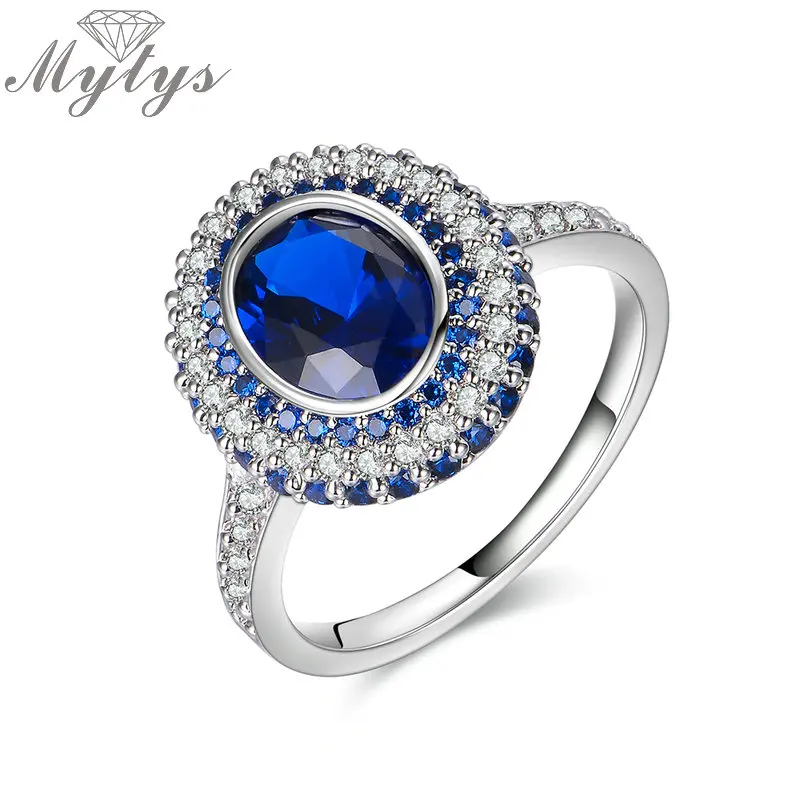 

Mytys Royal Blue Crystal Rings for Women High Level Bezel Setting Round Crystal Fashion Ring Jewelry Gift for Mother R1861