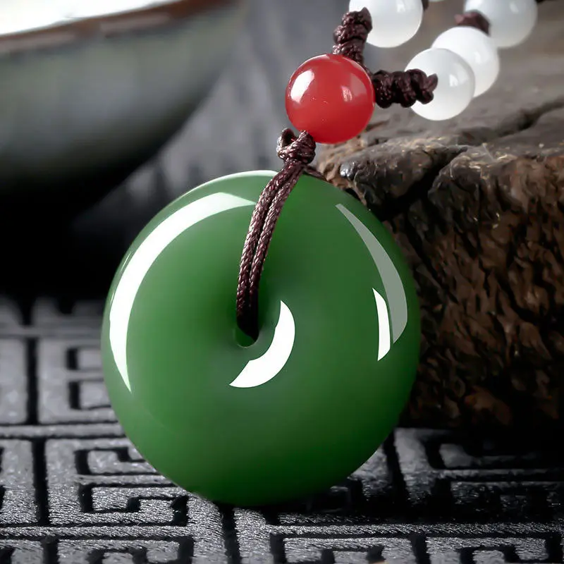 

China handcarved natural green jade Ping buckle pendant