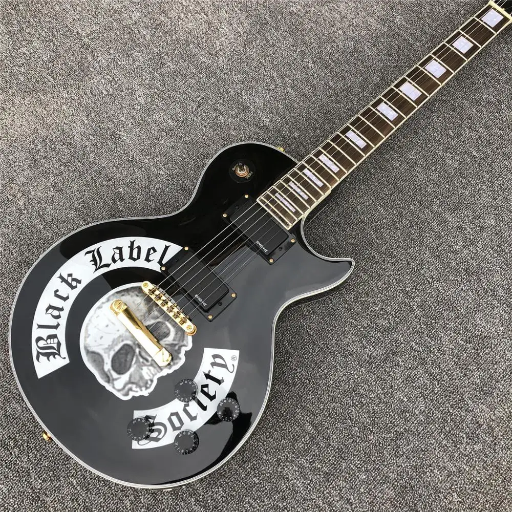

Gloss black Solid mahogany body Electric guitar Skull top Golden hardware Guitar