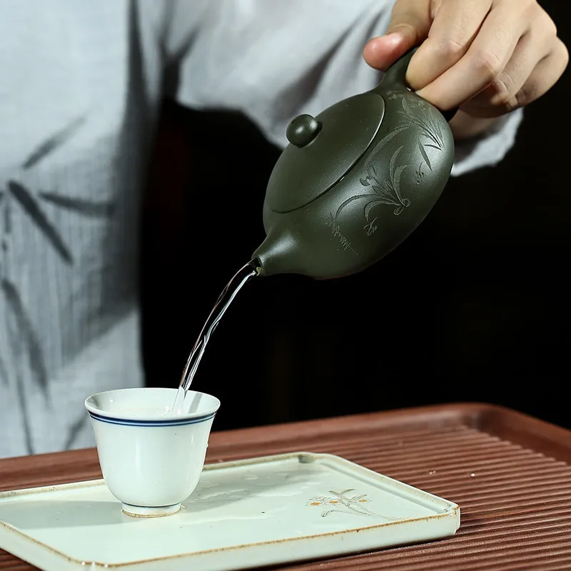 

Teaset 200cc Yixing pottery ore green mud flat Xi Shi kettle celebrity handmade carving orchid teapot