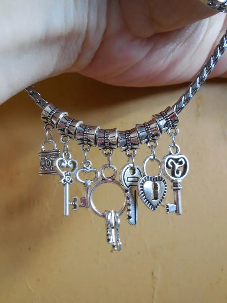 

100 pcs/Lot Mix heart turtle dog rabbit hope cross Vintage Silver Dangle Charms Jewelry DIY Findings For European Bracelet ZYY04