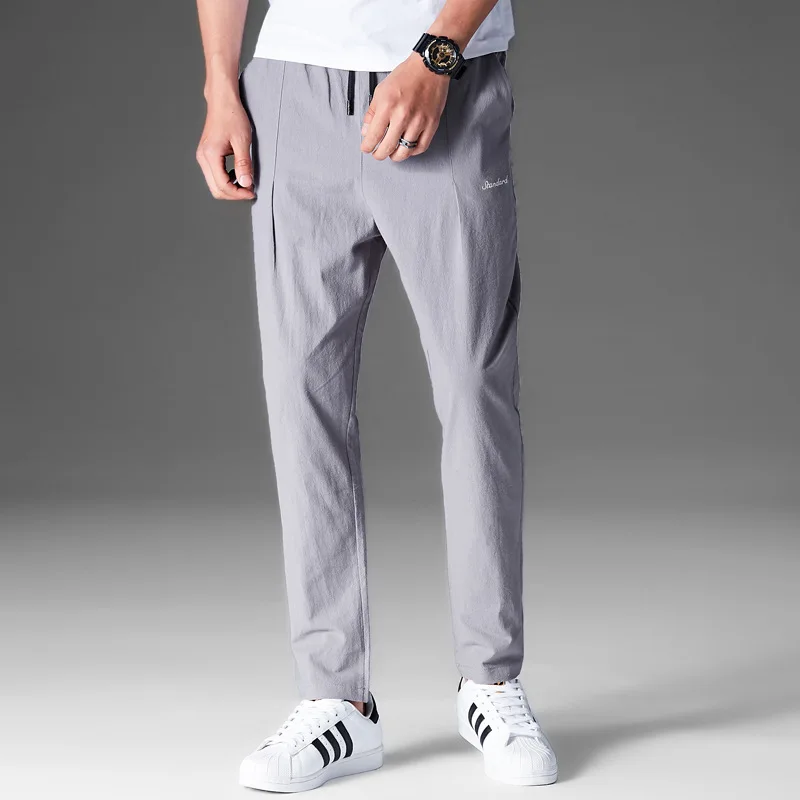 2019 new men's pants youth solid color cotton and linen casual pants male Korean version of the slim feet pants trend 5 colors