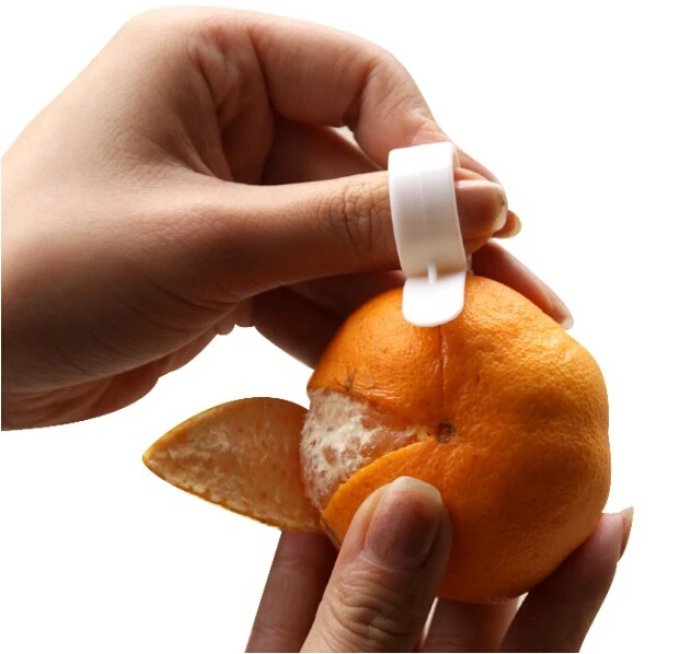 

Free shipping Open orange device cleverly ring Not to hurt the hand Snail open orange device Kitchen useful gadgets #371 Z