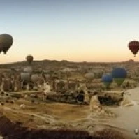 Hot air balloons over landscape at sunrise  Cappadocia  Central Anatolia Region  Turkey Poster Print (18 x 7)